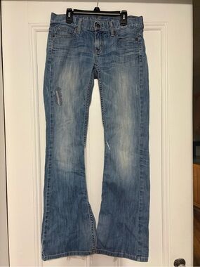 Vintage Guess Women's Light Blue Foxy Flare Jeans with Distressed Detail